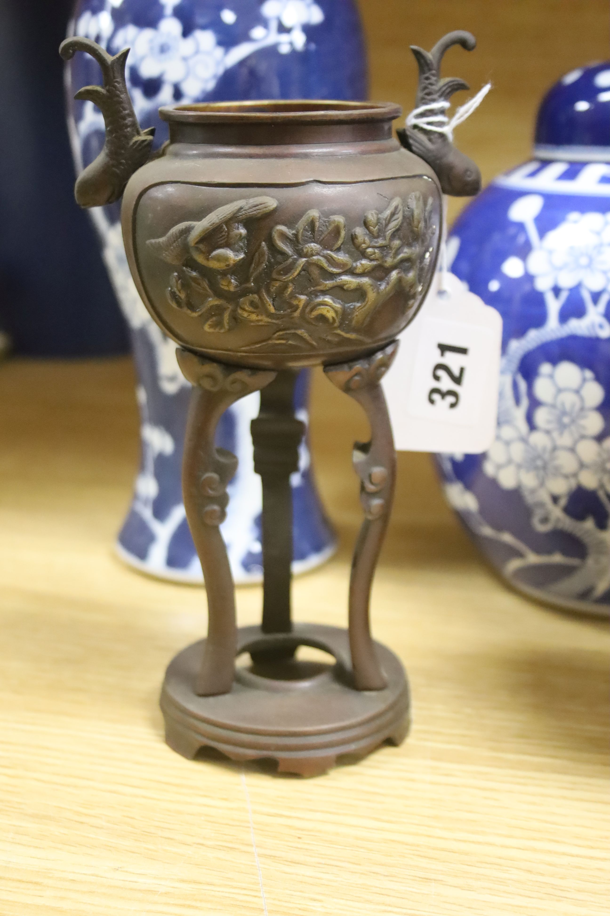 A Chinese blue and white cylindrical vase, another vase and cover and a blue and white jar and cover, together with a cloisonne vase and a bronze censer, tallest 32cm